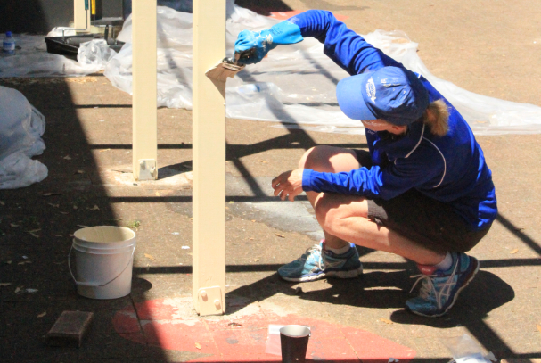 Mirvac employee painting at National Community Day