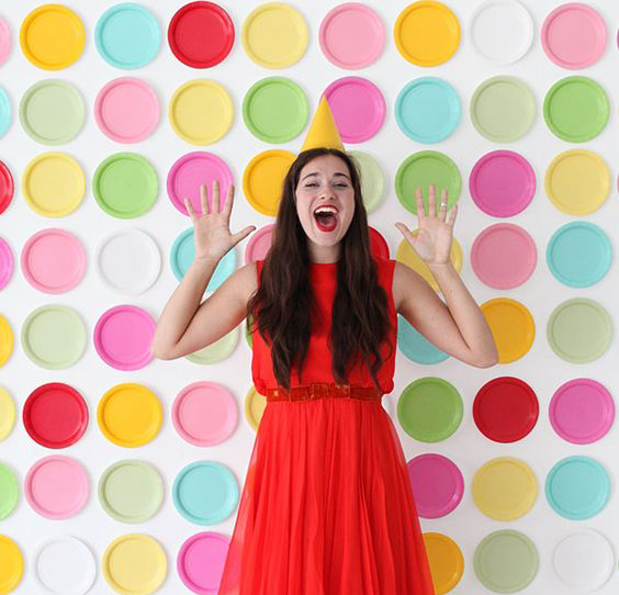 Lady in front of dot wall