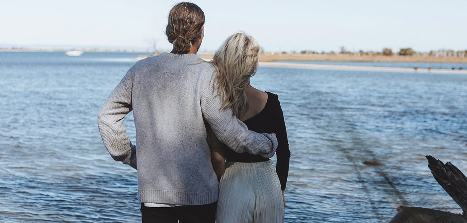 Couple looking at Osprey Waters estuary