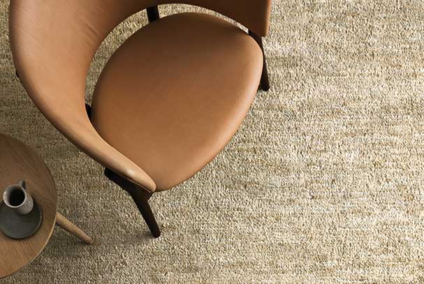 Tan chair sitting on rug