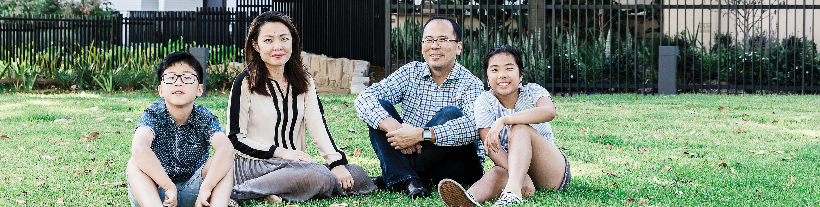 Family sitting outside Moreton Manor, Bondi
